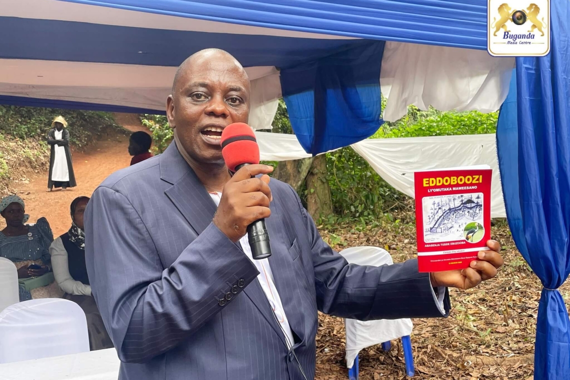 Minister Dr. Anthony Wamala delivers his message while holding the newly launched book Eddoboozi ly’Omutaka Maweesano Minister Dr. Anthony Wamala delivers his message while holding the newly launched book Eddoboozi ly’Omutaka Maweesano